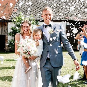 Natalie Dobrovodska with her husband Tomas Soucek and their daughter Trezka on their wedding day.